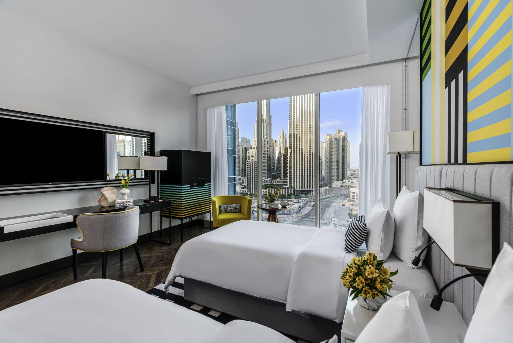 Pullman Dubai Downtown hotel exterior with Burj Khalifa in the background — photo 2