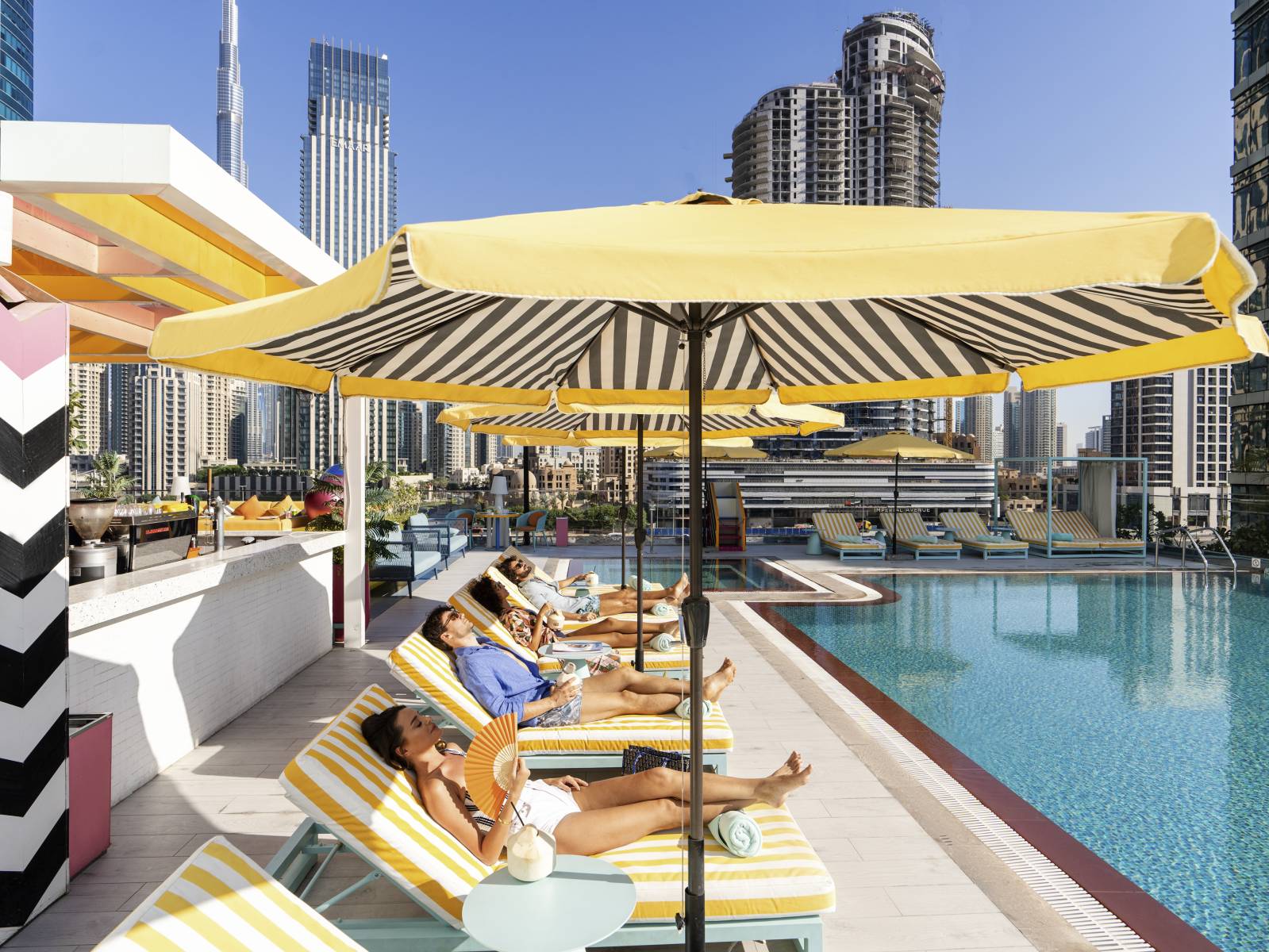 Pullman Dubai Downtown hotel exterior with Burj Khalifa in the background