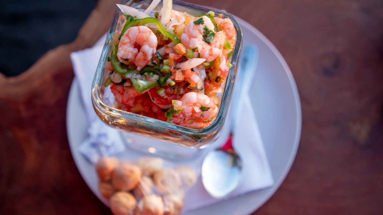 NAZCCA elegantly plated Nikkei ceviche with vibrant Peruvian garnishes